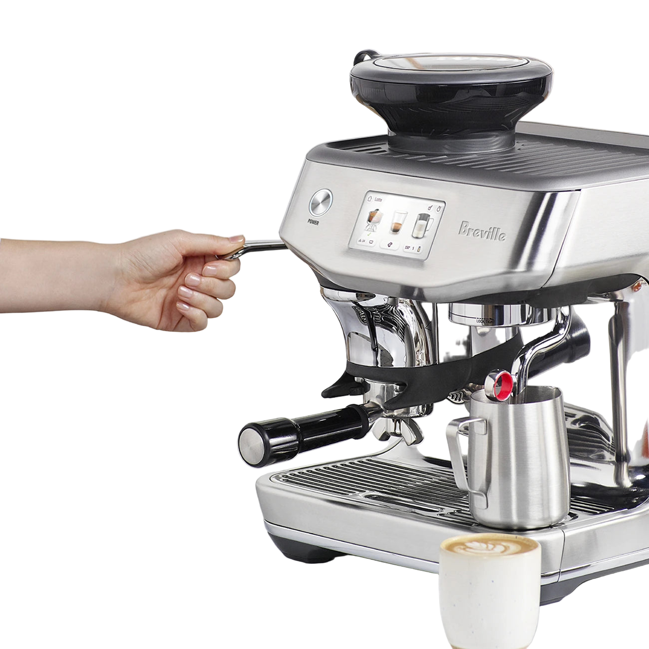 Barista using the Breville The Barista Touch Impress Espresso Machine