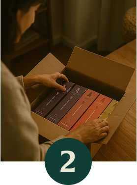 Person unpacking assorted Artizan organic coffee boxes in a shipping carton