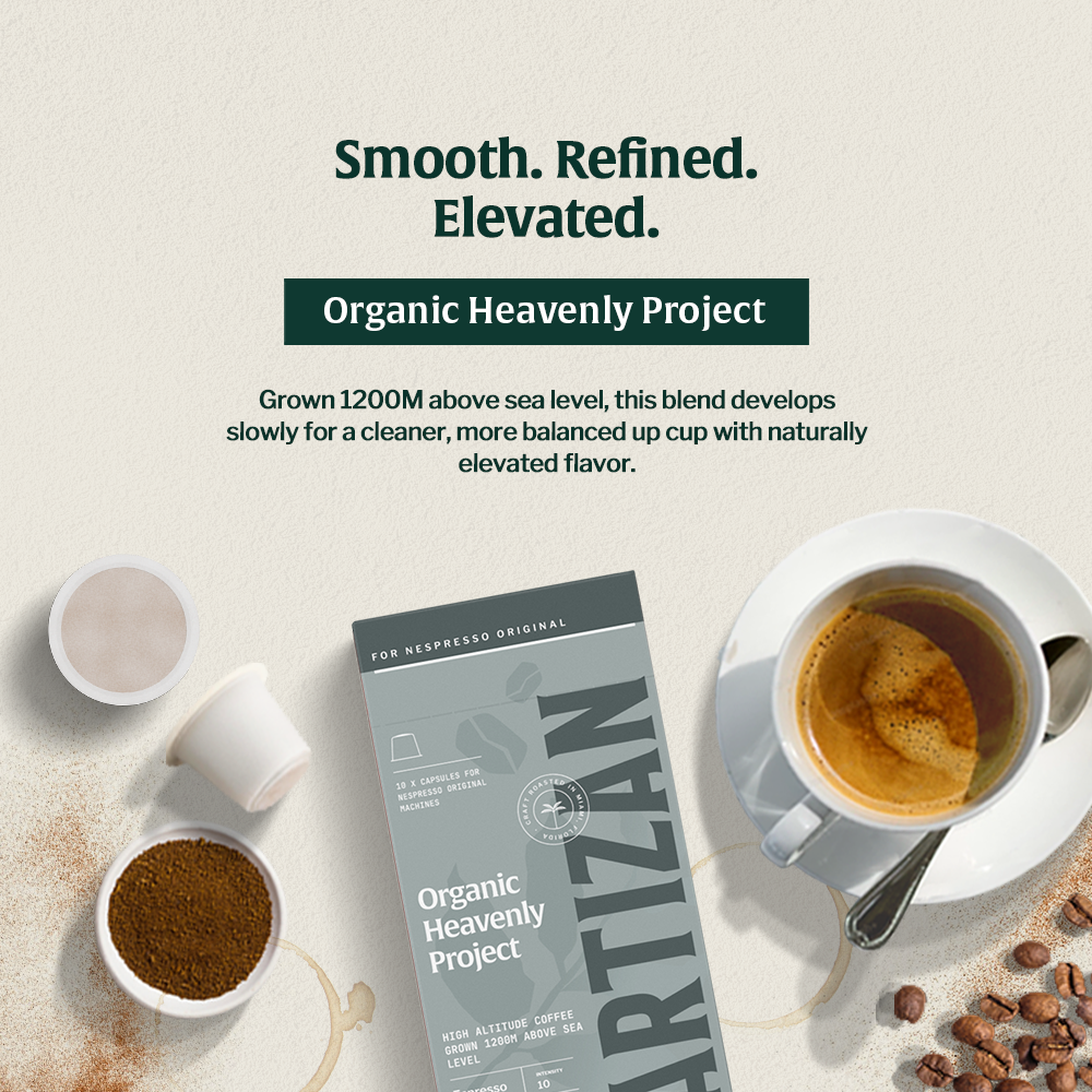 Cup of coffee of Heavlenly project and a statement on top saying: Smooth. Refined. Elevated. Organic Heavenly Project. Grown 1200M abose sea level, this blend develops slowly for a cleaner, more balanced up cup with naturally elevated flavor.