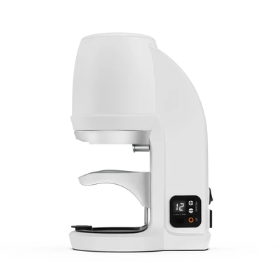 Side profile of Puqpress Q 58.3mm white automatic tamper showing modern design