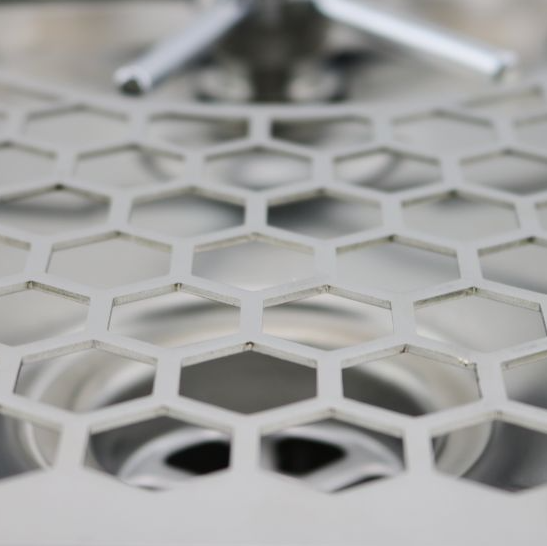 A close up look of Rhino Pitcher Rinser - 600mm - Spinjet on its tray.