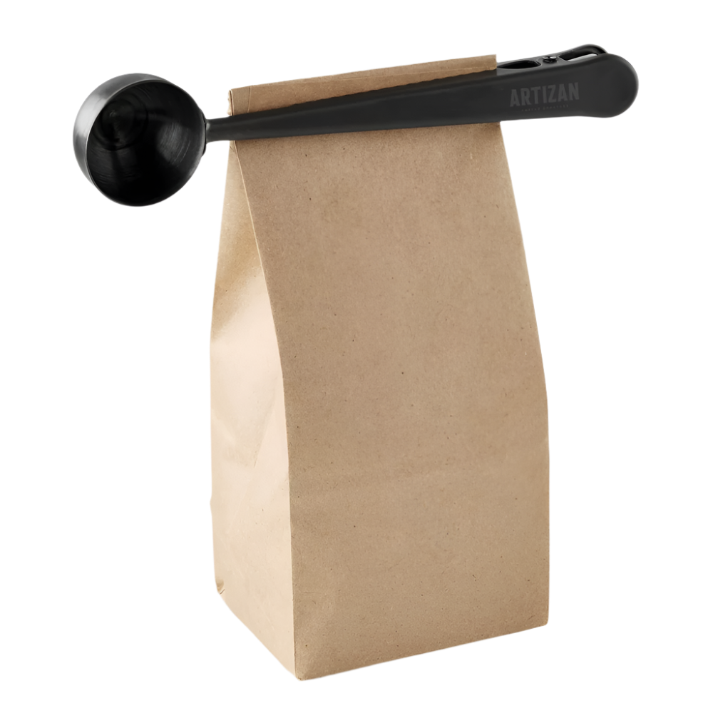 Coffee scoop with clip by Artizan Coffee, angled view showing deep spoon and sturdy handle