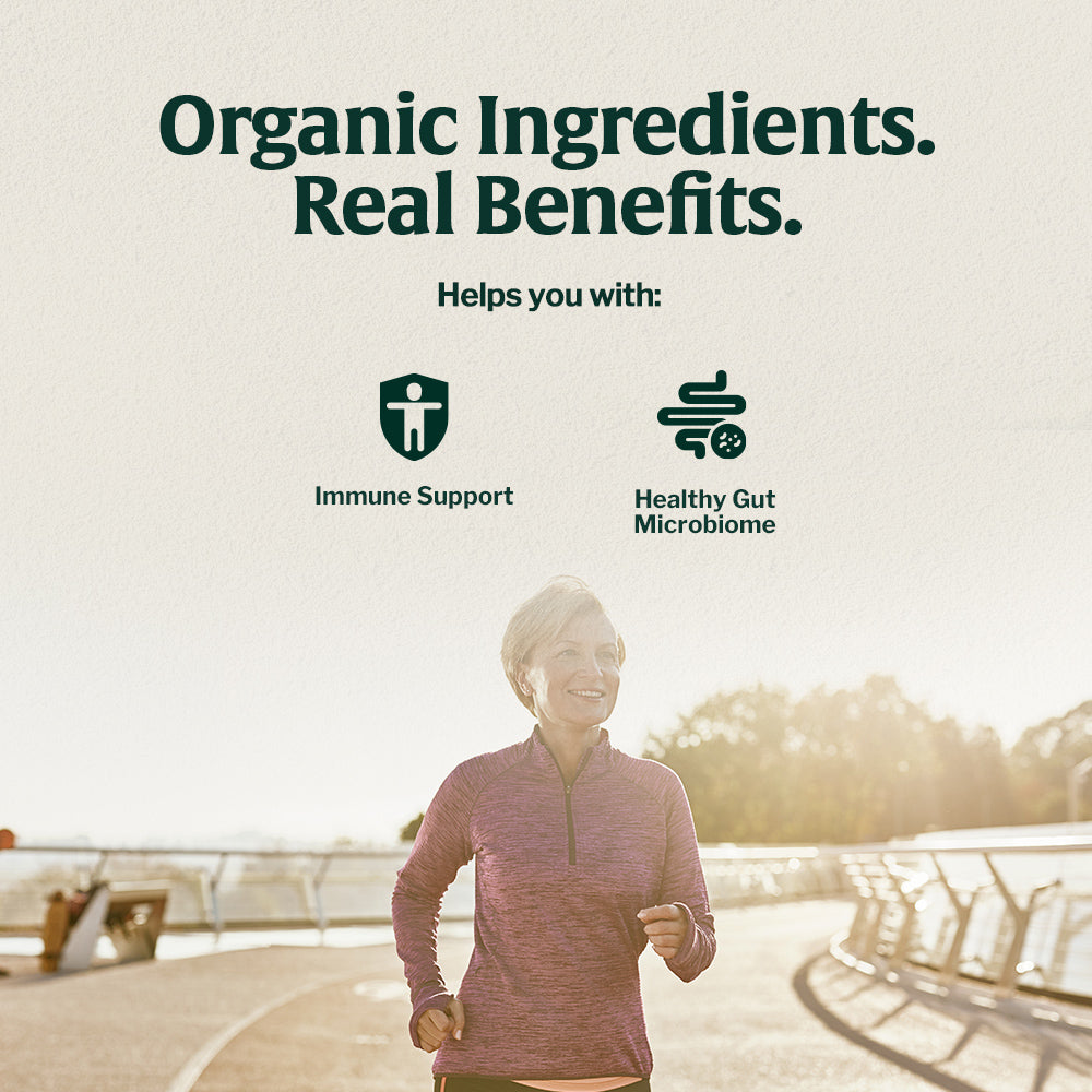 Active woman jogging outdoors representing immune support and healthy gut microbiome benefits of Artizan organic mushroom coffee.