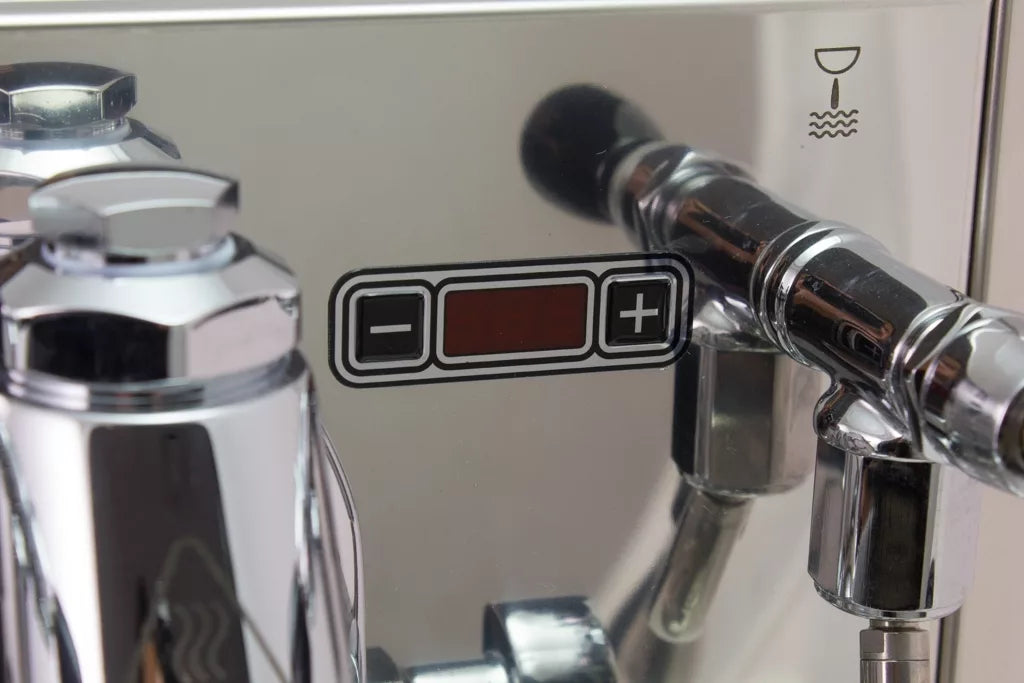 Close-up of Bezzera Mitica V2 HX espresso machine with digital control panel, plus/minus buttons, red display, and steam icon.