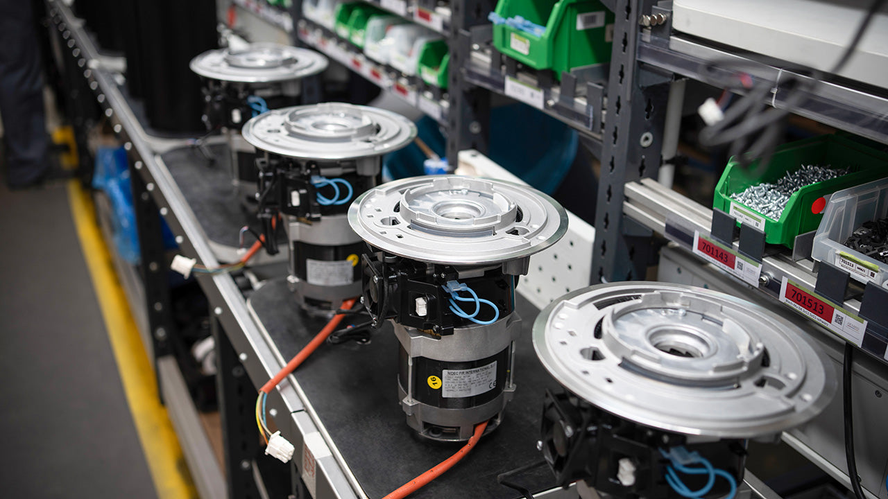 Assembly line of Mahlkönig E80S GBW grinder motors designed for powerful and reliable performance.