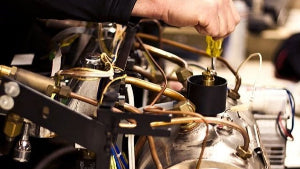 Espresso Machine Technician Fixing an Expresso Machine