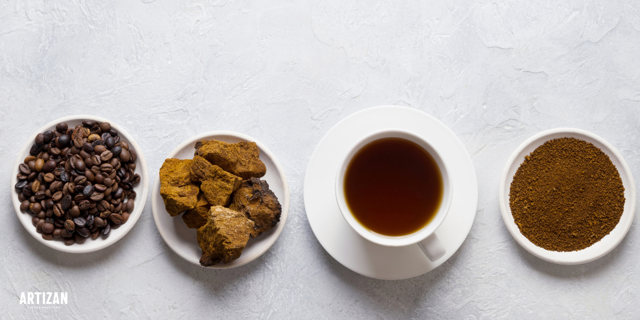 Flat lay of coffee beans, chaga chunks, a brewed coffee cup, and ground coffee, showing the ingredients and result of mushroom coffee.