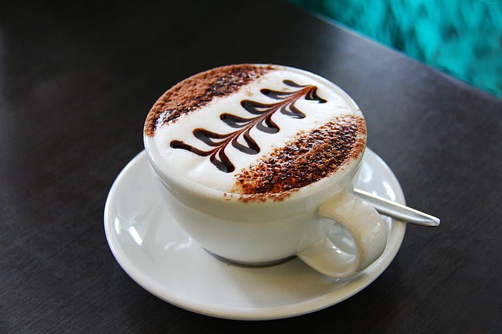 Image of a Cup of Flat White Coffee on Top of a Table