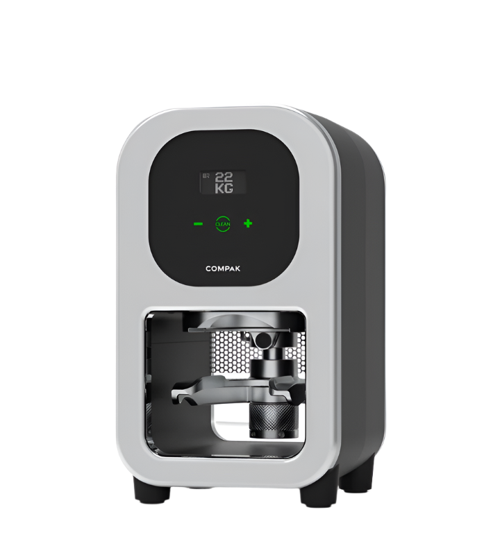 Angled view of Compak Cube Automatic Coffee Tamper with tamper head visible