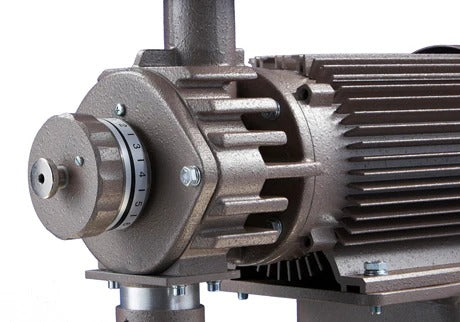 Close-up of Mahlkönig DK15 industrial grinder showing grind size adjustment knob and motor design.