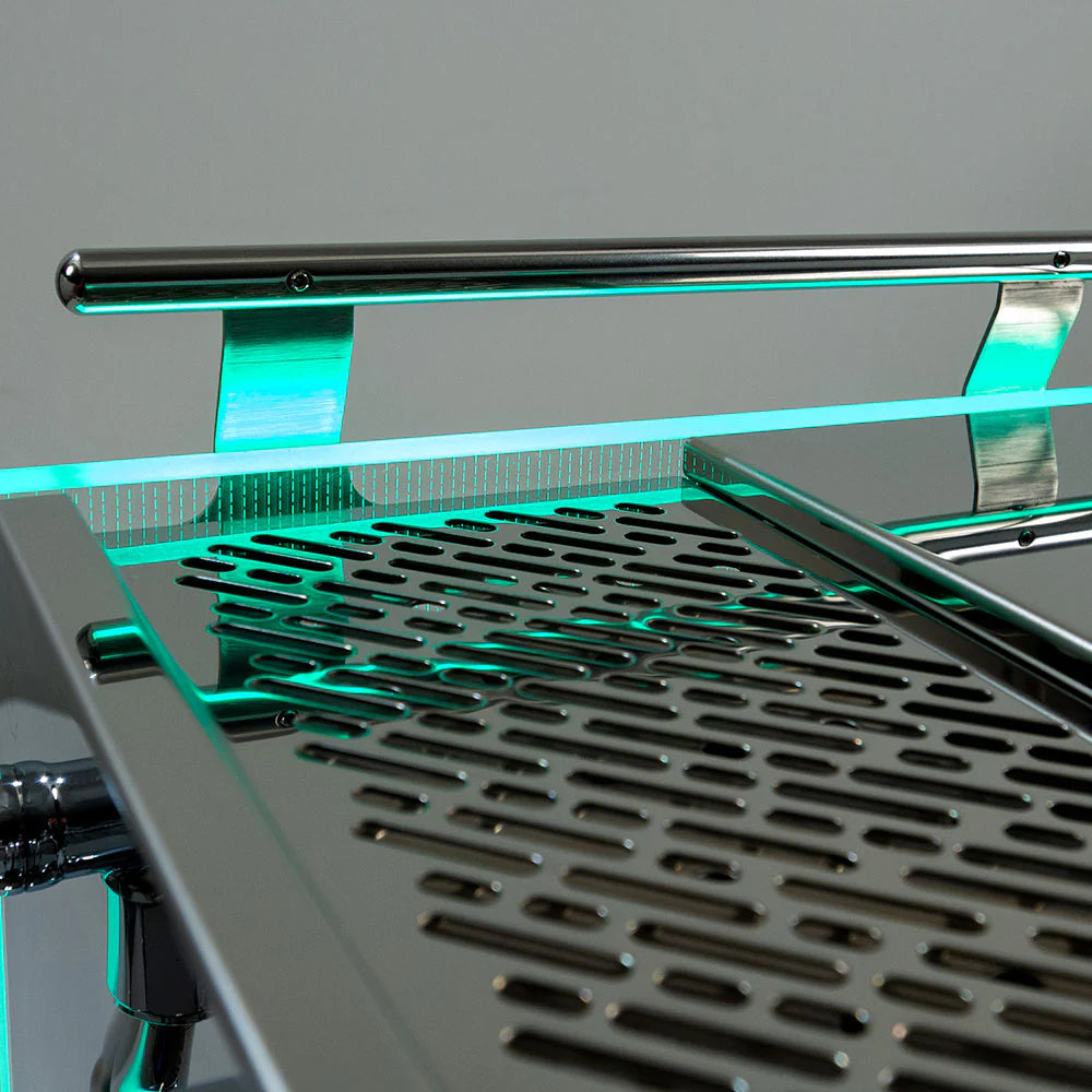 Top view of Bezzera Matrix MN espresso machine featuring modern design with illuminated green LED light accents.