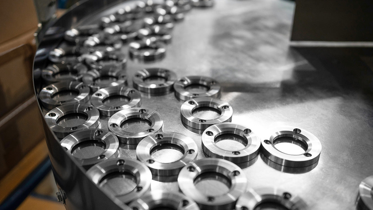 High-quality stainless steel 80mm burrs displayed during manufacturing process.