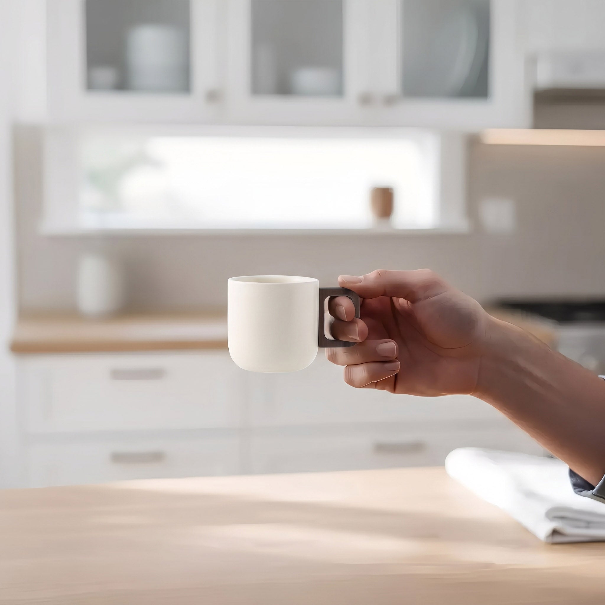 Elegant minimalist porcelain cream ceramic coffee mug with a modern handle, perfect for kitchen use.