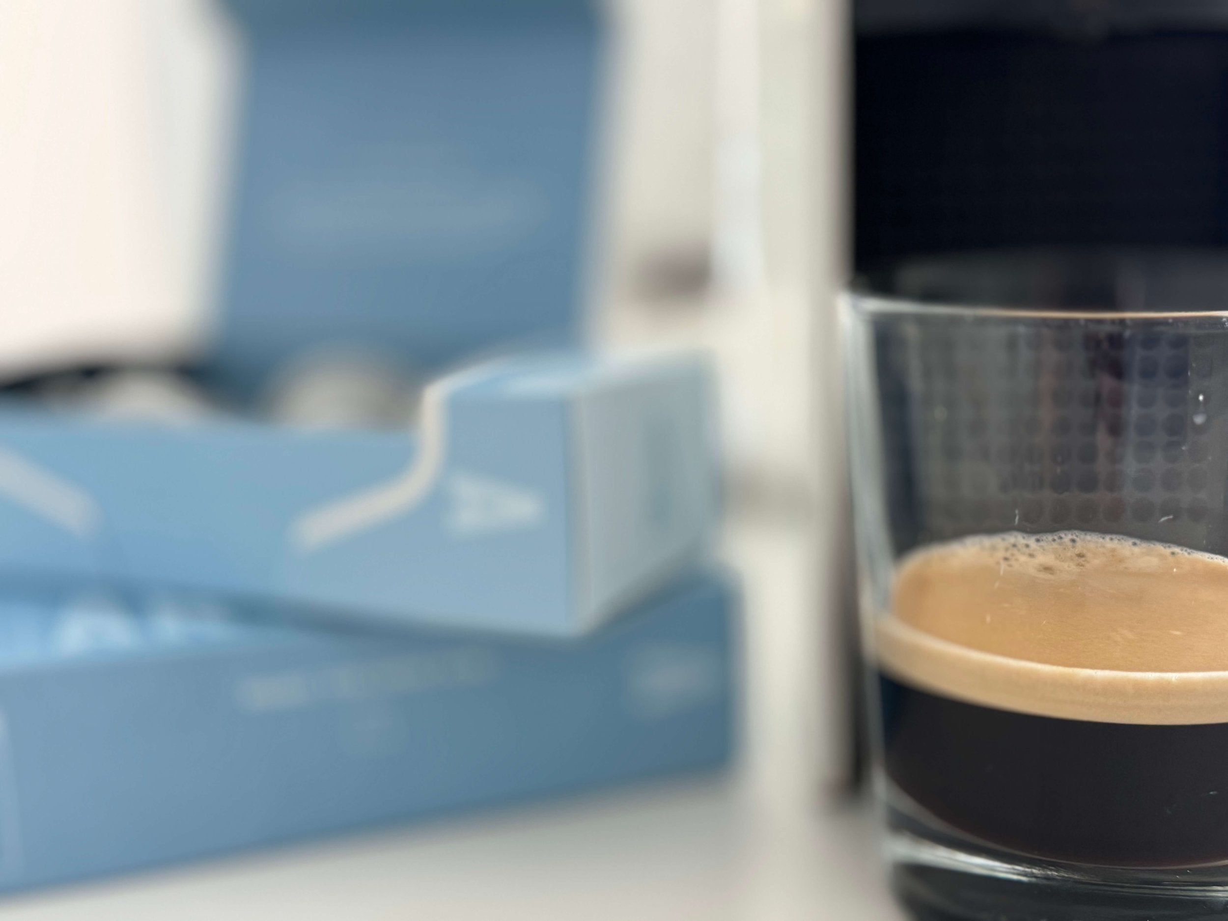 A glass half filled of organic iced coffee